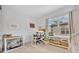 Bright home office with a large window and built-in shelving at 2162 Lake Howell Preserve Ct, Maitland, FL 32751