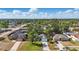 Aerial shot showcases a well-kept neighborhood with tree-lined streets, manicured lawns, and inviting curb appeal at 2277 Clearwater Dr, Deltona, FL 32738