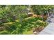 Aerial view of a spacious backyard with a lawn and trees at 2277 Clearwater Dr, Deltona, FL 32738