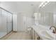Bright bathroom with a walk-in shower, single sink vanity, and ample counter space at 2277 Clearwater Dr, Deltona, FL 32738