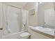 Clean bathroom featuring a shower-tub combo with white curtain and sink at 2277 Clearwater Dr, Deltona, FL 32738