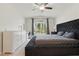 Inviting bedroom featuring natural light, a vanity, and a ceiling fan at 2277 Clearwater Dr, Deltona, FL 32738