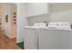 Convenient laundry room featuring a washer, dryer, and ample storage space at 2277 Clearwater Dr, Deltona, FL 32738