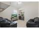 Bright living room with tiled floors, two sofas, a ceiling fan, and two tvs at 2277 Clearwater Dr, Deltona, FL 32738