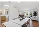 Spacious living room offers ample light, stylish furniture, and transitions to the dining and kitchen areas at 2277 Clearwater Dr, Deltona, FL 32738