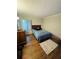 Bedroom with wood-look floors, neutral walls and bright window at 2301 Oak Park Way # 101, Orlando, FL 32822