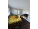 Bright bedroom with sliding glass door, wood-look floors and workstation area at 2301 Oak Park Way # 101, Orlando, FL 32822