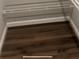 Walk in closet with closet organizers and wood-look floor at 2301 Oak Park Way # 101, Orlando, FL 32822