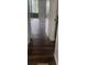 Hallway with wood-look floors that leads to screened porch at 2301 Oak Park Way # 101, Orlando, FL 32822