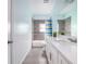 Bathroom featuring tiled walls, a mirror, and vanity with a countertop at 2314 Pennsylvania Ave, Oviedo, FL 32765