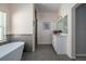Bright bathroom featuring tile flooring, a glass enclosed shower and a vanity with a white countertop at 2314 Pennsylvania Ave, Oviedo, FL 32765