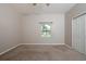 Bedroom with a ceiling fan, closet and a window overlooking the yard at 2314 Pennsylvania Ave, Oviedo, FL 32765