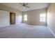 Large main bedroom with carpet floors and windows providing natural light at 2314 Pennsylvania Ave, Oviedo, FL 32765