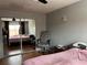 Cozy bedroom features a comfortable bed, ample closet space, and neutral wall color at 2487 Harbour Way, Winter Park, FL 32792