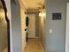 Hallway with laundry featuring a washer and dryer with updated lighting at 2487 Harbour Way, Winter Park, FL 32792