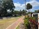 Community playground featuring picnic tables, playground equipment and lush greenery at 2487 Harbour Way, Winter Park, FL 32792