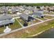 Aerial view of a home featuring a backyard with a trampoline and firepit, and solar panels at 2515 W End Dr, St Cloud, FL 34772