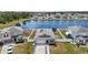 Aerial view of a beautiful home with solar panels, pond, manicured lawn and fenced yard at 2515 W End Dr, St Cloud, FL 34772