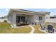 Relaxing covered back patio featuring a ceiling fan and outdoor seating, perfect for entertaining at 2515 W End Dr, St Cloud, FL 34772