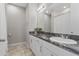 Bathroom features a vanity with black granite countertop, chrome fixtures, and a standard toilet at 2515 W End Dr, St Cloud, FL 34772