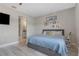 Bedroom features stylish decor, comfortable bed, and an adjacent bathroom at 2515 W End Dr, St Cloud, FL 34772