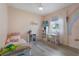 Light, room featuring a cozy bed, desk area, wood-look floors, and a window with natural light at 2515 W End Dr, St Cloud, FL 34772