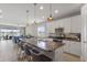 Modern kitchen with granite countertops, stainless steel appliances, and breakfast bar seating at 2515 W End Dr, St Cloud, FL 34772