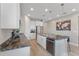 Spacious kitchen with stainless steel appliances, granite countertops and white cabinetry at 2515 W End Dr, St Cloud, FL 34772