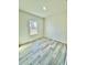 Bright bedroom with light-colored hardwood floors and a window with a view at 273 Marion Oaks Golf Rd, Ocala, FL 34473