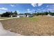 Side view of a modern white home with black trim and a well-manicured lawn at 273 Marion Oaks Golf Rd, Ocala, FL 34473