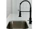 Close-up of kitchen sink with a sleek black faucet and a modern countertop at 273 Marion Oaks Golf Rd, Ocala, FL 34473