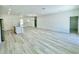 Bright open-concept living room with light-colored wood floors, recessed lighting, and an open concept kitchen at 273 Marion Oaks Golf Rd, Ocala, FL 34473