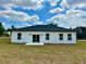 A lovely home featuring a rear exterior with a sliding door and nice backyard at 273 Marion Oaks Golf Rd, Ocala, FL 34473