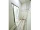 Bright walk-in closet with wood-look floors and wire shelving system at 273 Marion Oaks Golf Rd, Ocala, FL 34473