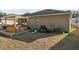 Backyard view showcasing a hot tub with pergola and patio area at 34423 Alameda Dr, Sorrento, FL 32776
