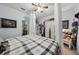 View of the bedroom with a queen bed and white wardrobe and access to the connected bathroom at 34423 Alameda Dr, Sorrento, FL 32776