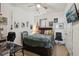 Bedroom featuring a queen bed and a desk with an office chair at 34423 Alameda Dr, Sorrento, FL 32776