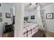 Bedroom featuring a queen bed with a grey and white comforter and white privacy curtains at 34423 Alameda Dr, Sorrento, FL 32776