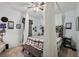Bedroom featuring a ceiling fan, carpet flooring and a queen bed with a dark wood bench at 34423 Alameda Dr, Sorrento, FL 32776