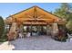Community clubhouse with stone pillars and outdoor seating area at 34423 Alameda Dr, Sorrento, FL 32776