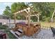 Backyard with a hot tub featuring a custom wooden pergola and bar area at 34423 Alameda Dr, Sorrento, FL 32776