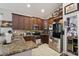 Well-equipped kitchen boasts stainless steel appliances, granite counters, and ample cabinet space with a wine rack at 34423 Alameda Dr, Sorrento, FL 32776