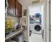 Laundry room featuring granite countertops and washer and dryer units at 34423 Alameda Dr, Sorrento, FL 32776
