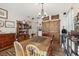 Comfortable living room with hardwood floors, a large dining table, and ample storage space at 34423 Alameda Dr, Sorrento, FL 32776