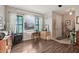 Inviting living room with a large window, hardwood floors, and a cozy atmosphere at 34423 Alameda Dr, Sorrento, FL 32776