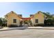 Pool area access with matching yellow buildings and pergola-covered entrance at 34423 Alameda Dr, Sorrento, FL 32776