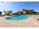 Beautifully landscaped pool area with ample seating, lush trees and plenty of space to relax, and enjoy the sun at 34423 Alameda Dr, Sorrento, FL 32776