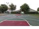 Outdoor basketball court with trees and sports field at 3661 Kingswood Ct, Clermont, FL 34711