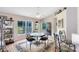 Bright dining room with a ceiling fan and views of the backyard through sliding glass doors at 3661 Kingswood Ct, Clermont, FL 34711