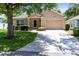Attractive single-story home with well-kept lawn and a attached garage at 3661 Kingswood Ct, Clermont, FL 34711
